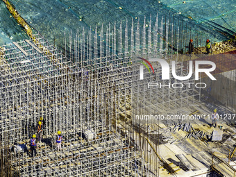 Workers are reinforcing the Yundong Gate at the construction site for the Subei Irrigation Canal in Huai'an, China, on February 16, 2024. (