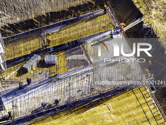 Workers are reinforcing the Yundong Gate at the construction site for the Subei Irrigation Canal in Huai'an, China, on February 16, 2024. (