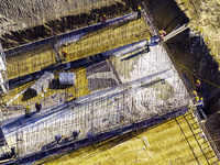 Workers are reinforcing the Yundong Gate at the construction site for the Subei Irrigation Canal in Huai'an, China, on February 16, 2024. (