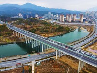 A large number of vehicles are traveling slowly on the Shanghai-Wuhai Expressway in Yuexi County, Anqing City, Anhui Province, China, on Feb...