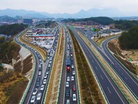 A large number of vehicles are traveling slowly on the Shanghai-Wuhai Expressway in Yuexi County, Anqing City, Anhui Province, China, on Feb...