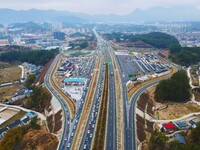 A large number of vehicles are traveling slowly on the Shanghai-Wuhai Expressway in Yuexi County, Anqing City, Anhui Province, China, on Feb...