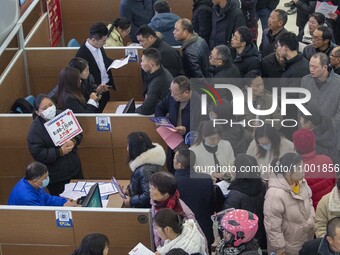 Job seekers are exchanging employment information with employers at the large-scale human resources trade fair in Haian, East China's Jiangs...