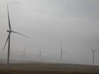 Wind turbines are standing under a sandstorm in Yongchang, Gansu Province, China, on February 17, 2024. (