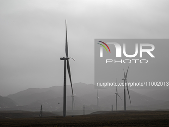 Wind turbines are standing under a sandstorm in Yongchang, Gansu Province, China, on February 17, 2024. (