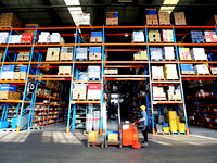 Workers are working at a warehouse at a logistics enterprise in the Lianyun district of Lianyungang city, Jiangsu province, East China, on F...