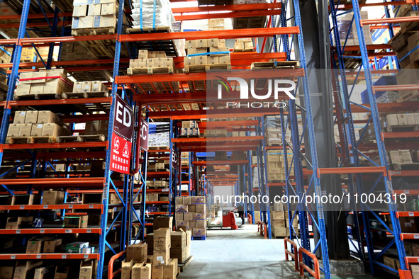 Workers are working at a warehouse at a logistics enterprise in the Lianyun district of Lianyungang city, Jiangsu province, East China, on F...