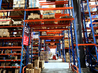 Workers are working at a warehouse at a logistics enterprise in the Lianyun district of Lianyungang city, Jiangsu province, East China, on F...