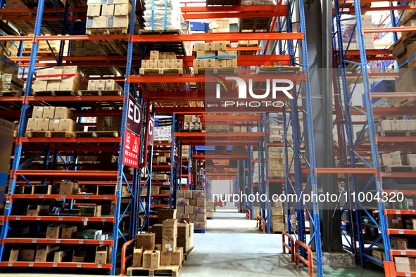 Workers are working at a warehouse at a logistics enterprise in the Lianyun district of Lianyungang city, Jiangsu province, East China, on F...