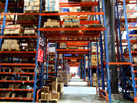 Workers are working at a warehouse at a logistics enterprise in the Lianyun district of Lianyungang city, Jiangsu province, East China, on F...