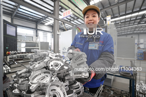 A worker is producing auto parts at a company in Lianyungang, China, on February 18, 2024. 