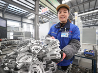 A worker is producing auto parts at a company in Lianyungang, China, on February 18, 2024. (