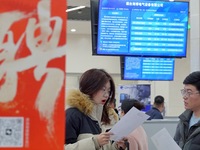 Job seekers are talking with employers at the 2024 job fair in Yantai, China, on February 18, 2024. In 2023, 12.44 million new urban jobs we...