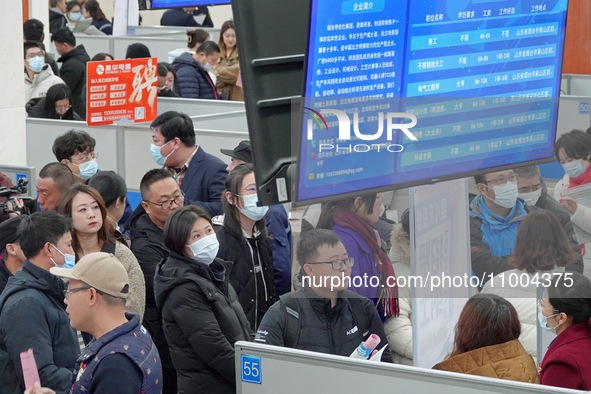 Job seekers are learning about employment information at the 2024 job fair in Yantai, China, on February 18, 2024. In 2023, 12.44 million ne...