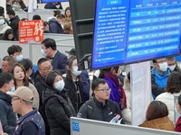 Job seekers are learning about employment information at the 2024 job fair in Yantai, China, on February 18, 2024. In 2023, 12.44 million ne...