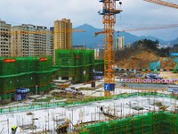 Workers are working at the construction site of a resettlement area project in Yuexi County, Anqing, China, on February 18, 2024. (