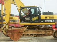 Construction workers are driving an excavator to start construction of the main campus of the Hangzhou Institute for Advanced Studies at the...