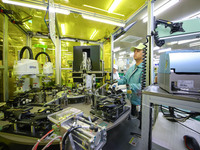 A worker is working in a workshop at an automotive electronics company in Qingdao, Shandong Province, China, on February 18, 2024. (