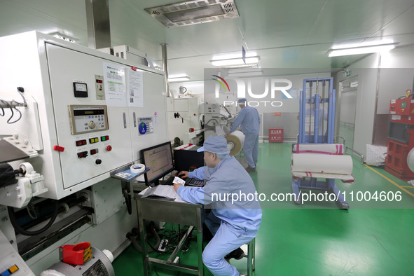 A worker is working in a production workshop at a pharmaceutical packaging company in Lianyungang, China, on February 18, 2024. 