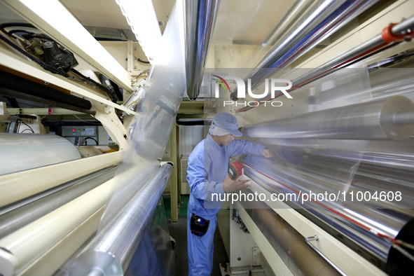 A worker is working in a production workshop at a pharmaceutical packaging company in Lianyungang, China, on February 18, 2024. 