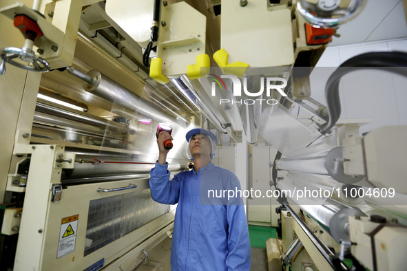 A worker is working in a production workshop at a pharmaceutical packaging company in Lianyungang, China, on February 18, 2024. 