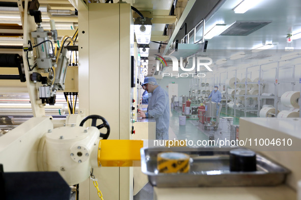 A worker is working in a production workshop at a pharmaceutical packaging company in Lianyungang, China, on February 18, 2024. 