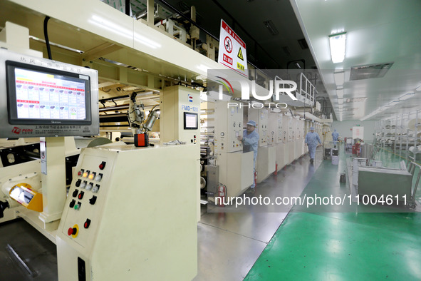 A worker is working in a production workshop at a pharmaceutical packaging company in Lianyungang, China, on February 18, 2024. 