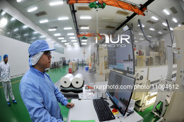 A worker is working in a production workshop at a pharmaceutical packaging company in Lianyungang, China, on February 18, 2024. 