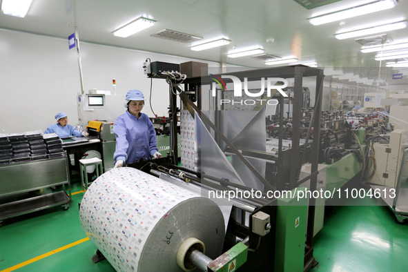 A worker is working in a production workshop at a pharmaceutical packaging company in Lianyungang, China, on February 18, 2024. 