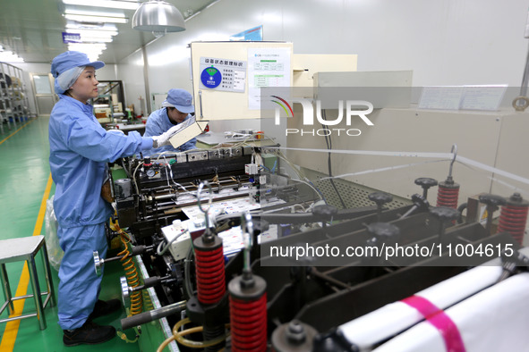 A worker is working in a production workshop at a pharmaceutical packaging company in Lianyungang, China, on February 18, 2024. 