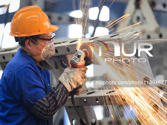 A worker is grinding at the production workshop of Nanjing Changjiang Industrial Furnace Technology Group Co., Ltd. in Nanjing, Jiangsu Prov...