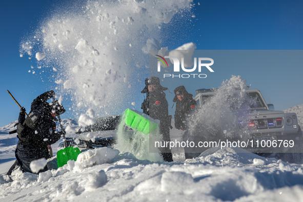 Border police are rescuing a stranded vehicle in Altay, Xinjiang province, China, on February 18, 2024, as the lowest temperature reaches -5...