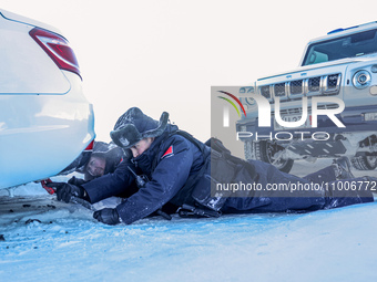 Border police are rescuing a stranded vehicle in Altay, Xinjiang province, China, on February 18, 2024, as the lowest temperature reaches -5...