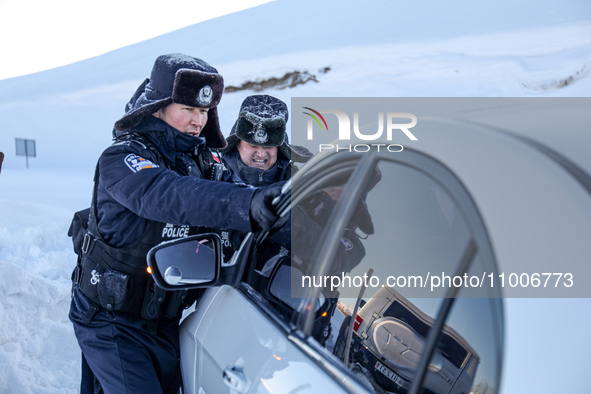 Border police are rescuing a stranded vehicle in Altay, Xinjiang province, China, on February 18, 2024, as the lowest temperature reaches -5...