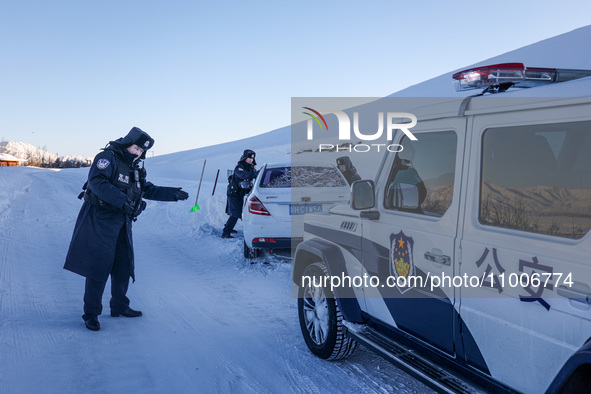 Border police are rescuing a stranded vehicle in Altay, Xinjiang province, China, on February 18, 2024, as the lowest temperature reaches -5...