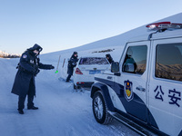 Border police are rescuing a stranded vehicle in Altay, Xinjiang province, China, on February 18, 2024, as the lowest temperature reaches -5...