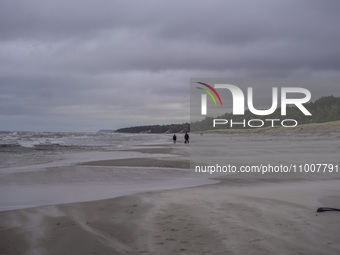 The coast of the Baltic Sea is being destroyed by a winter storm, with fallen cliffs and uprooted trees visible in Oslonino, Poland, on Janu...