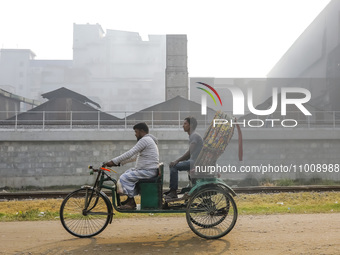 Smoke is rising from a re-rolling mill, polluting the air in Dhaka, Bangladesh, on February 19, 2024. (