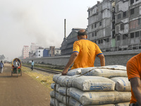 Smoke is rising from a re-rolling mill, polluting the air in Dhaka, Bangladesh, on February 19, 2024. (