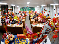 Students are waiting to receive new textbooks in a classroom of the second grade at Yuanqian Primary School in Lianyungang, China, on Februa...