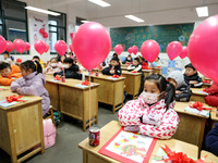 Students are waiting to receive new textbooks in a classroom of the second grade at Yuanqian Primary School in Lianyungang, China, on Februa...