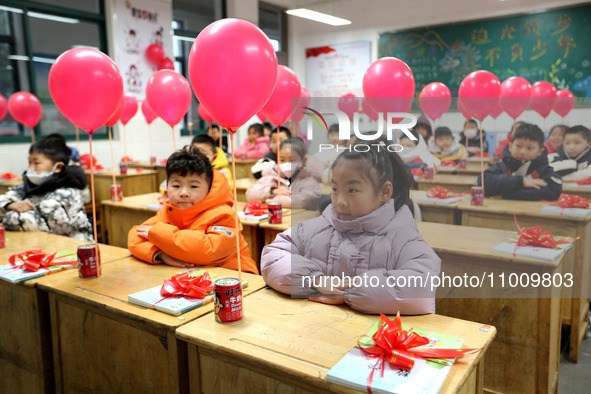 Students are waiting to receive new textbooks in a classroom of the second grade at Yuanqian Primary School in Lianyungang, China, on Februa...