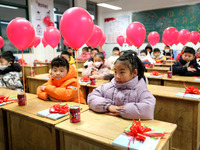 Students are waiting to receive new textbooks in a classroom of the second grade at Yuanqian Primary School in Lianyungang, China, on Februa...