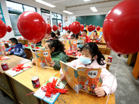 Students are reading new textbooks they have just received in a classroom of the second grade at Yuanqian Primary School in Lianyungang, Chi...