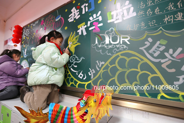 Students are preparing for the first lesson in a classroom at Yuanqian Primary School in Lianyungang, China, on February 20, 2024. 