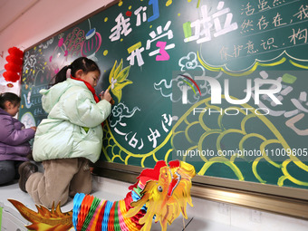 Students are preparing for the first lesson in a classroom at Yuanqian Primary School in Lianyungang, China, on February 20, 2024. (