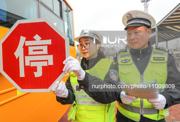 Police are conducting a safety check on a school bus at Erdu Primary School in Huzhou, China, on February 20, 2024. 