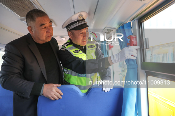 Police are conducting a safety check on a school bus at Erdu Primary School in Huzhou, China, on February 20, 2024. 