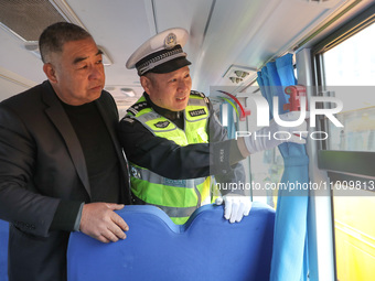 Police are conducting a safety check on a school bus at Erdu Primary School in Huzhou, China, on February 20, 2024. (