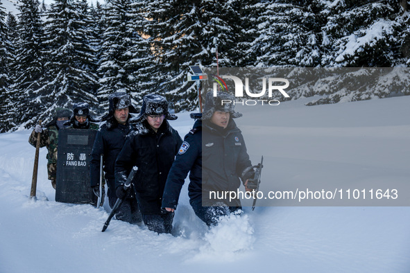 Border police are patrolling the border in heavy snow at -33 degrees Celsius in Altay, Xinjiang Province, China, on February 20, 2024. 